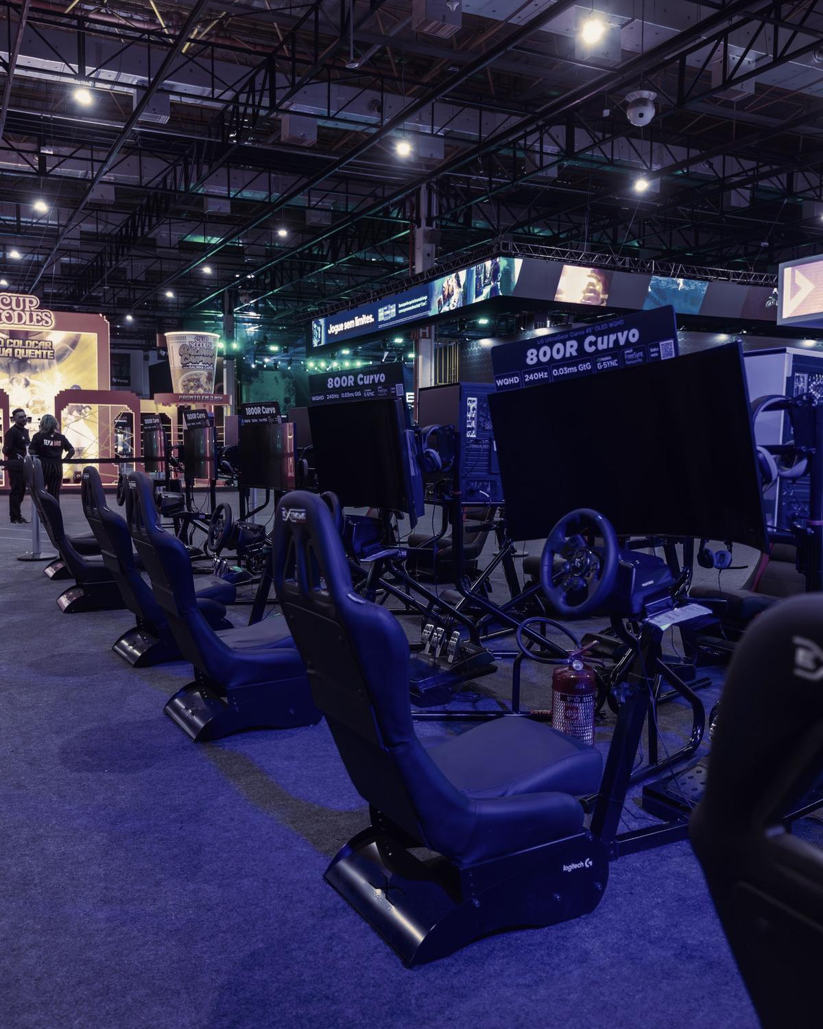Racing simulator cockpits with wraparound screens at Gravity Arena